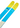 Close-up of LINE Tom Wallisch Pro ski tails: blue and yellow twin-tip design with playful atomic and measurement graphics for freestyle performance
