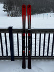 Front view of Atomic 2023-2023 Redster G9 NASTAR level skis in a snowy setting