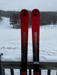 Tips of Atomic 2023-2023 Redster G9 NASTAR level skis in a snowy setting