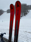 Angled view of Atomic 2023-2023 Redster G9 NASTAR level ski tips in a snowy setting