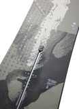 Detailed view of Burton Instigator Flat Top snowboard graphic featuring abstract grayscale design and hidden word art, symbolizing creativity and confidence for new riders