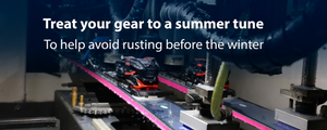 Skis getting tuned by MTNside's automated machine, Big Blue Zoom, with the text overlay saying, "Treat your gear to a summer tune; To help avoid rusting before the winter"