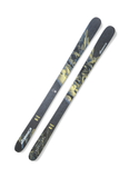 Top view of Nordica Enforcer 94 men’s all-mountain skis in black and yellow design, showcasing wood core construction with carbon and metal laminates for powerful yet smooth handling on varied snow conditions