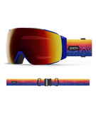Smith I/O MAG Justin Lovato Red Snow Goggles with ChromaPop Sun Red Mirror lens: artistic red, yellow, and blue gradient strap for bold mountain style. Offers quick MAG lens interchange, anti-fog tech, and superior peripheral vision