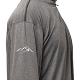 Close-up of grey men’s quarter-zip pullover sleeve featuring embroidered white Wachusett Mountain swoosh logo on performance fabric